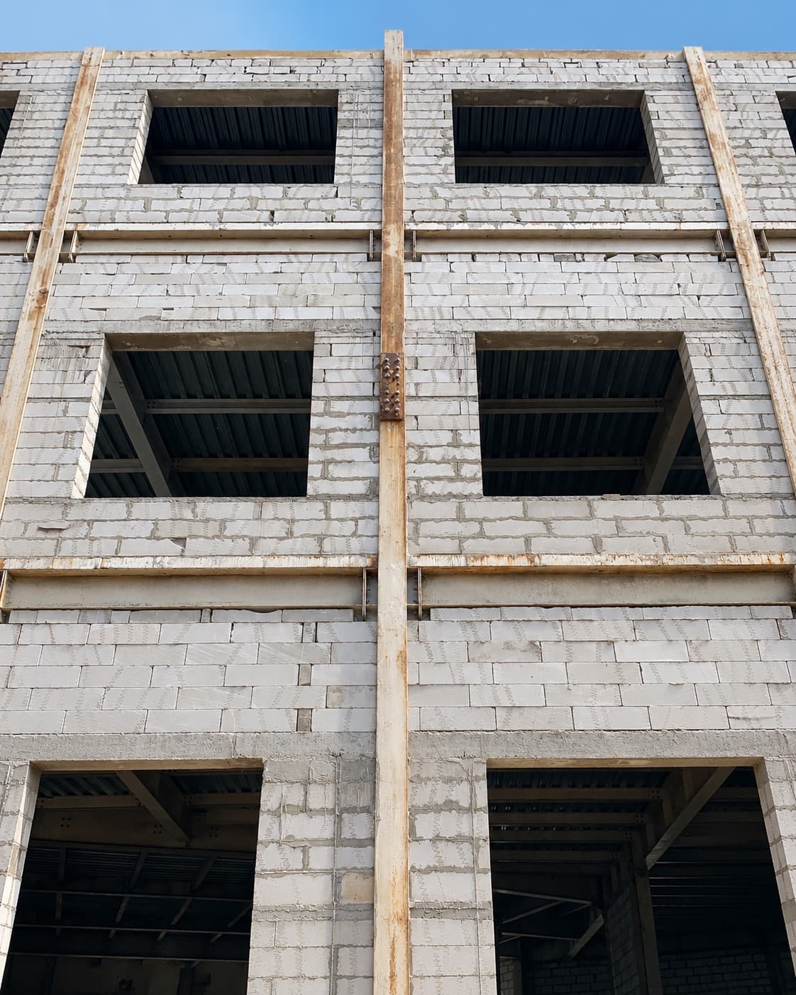 Blockwork rising against the steel frame