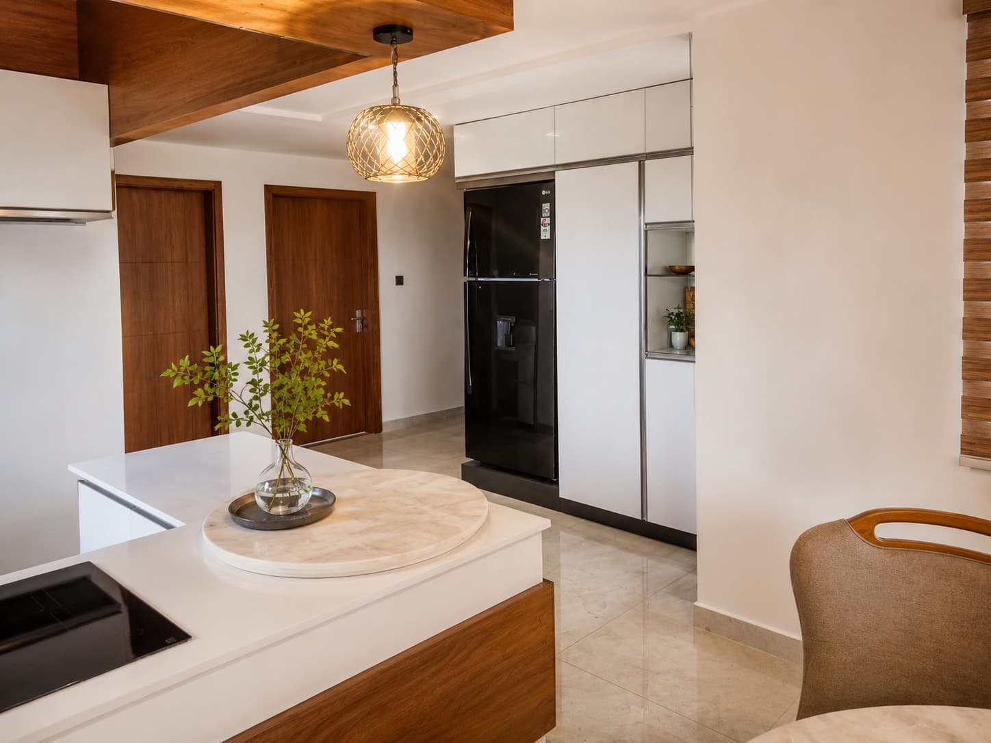 Village Nest — open kitchen with a quartz island and walnut joinery